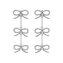 Load image into Gallery viewer, Silver Hypoallergenic Titanium Post Textured Bow Link Dropdown Earrings
