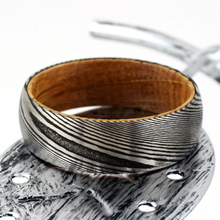 Load image into Gallery viewer, Men&#39;s Black Damascus Steel Wedding Band with Whiskey Barrel Wood Sleeve - Rings for Men and Women
