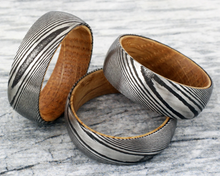 Load image into Gallery viewer, Men&#39;s Black Damascus Steel Wedding Band with Whiskey Barrel Wood Sleeve - Rings for Men and Women
